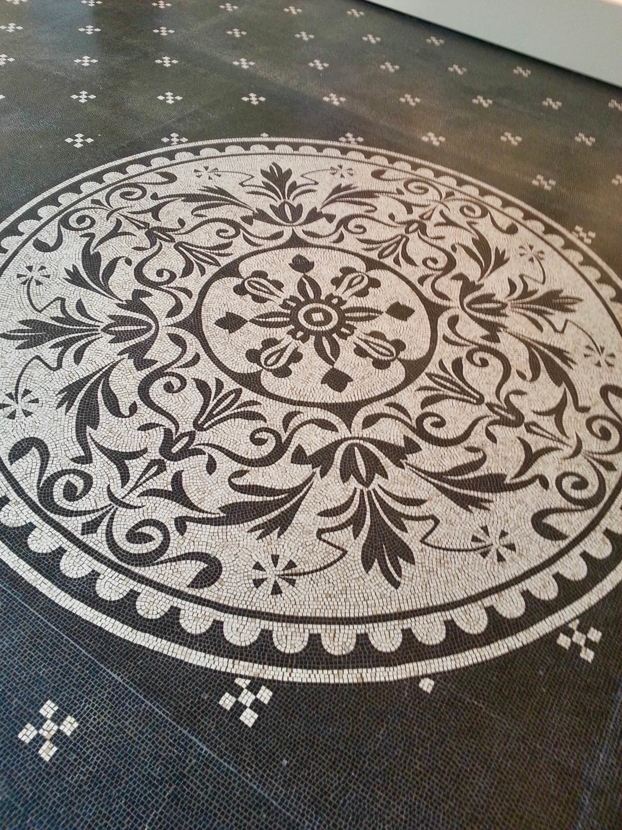 Decorative circular pattern on a textured surface