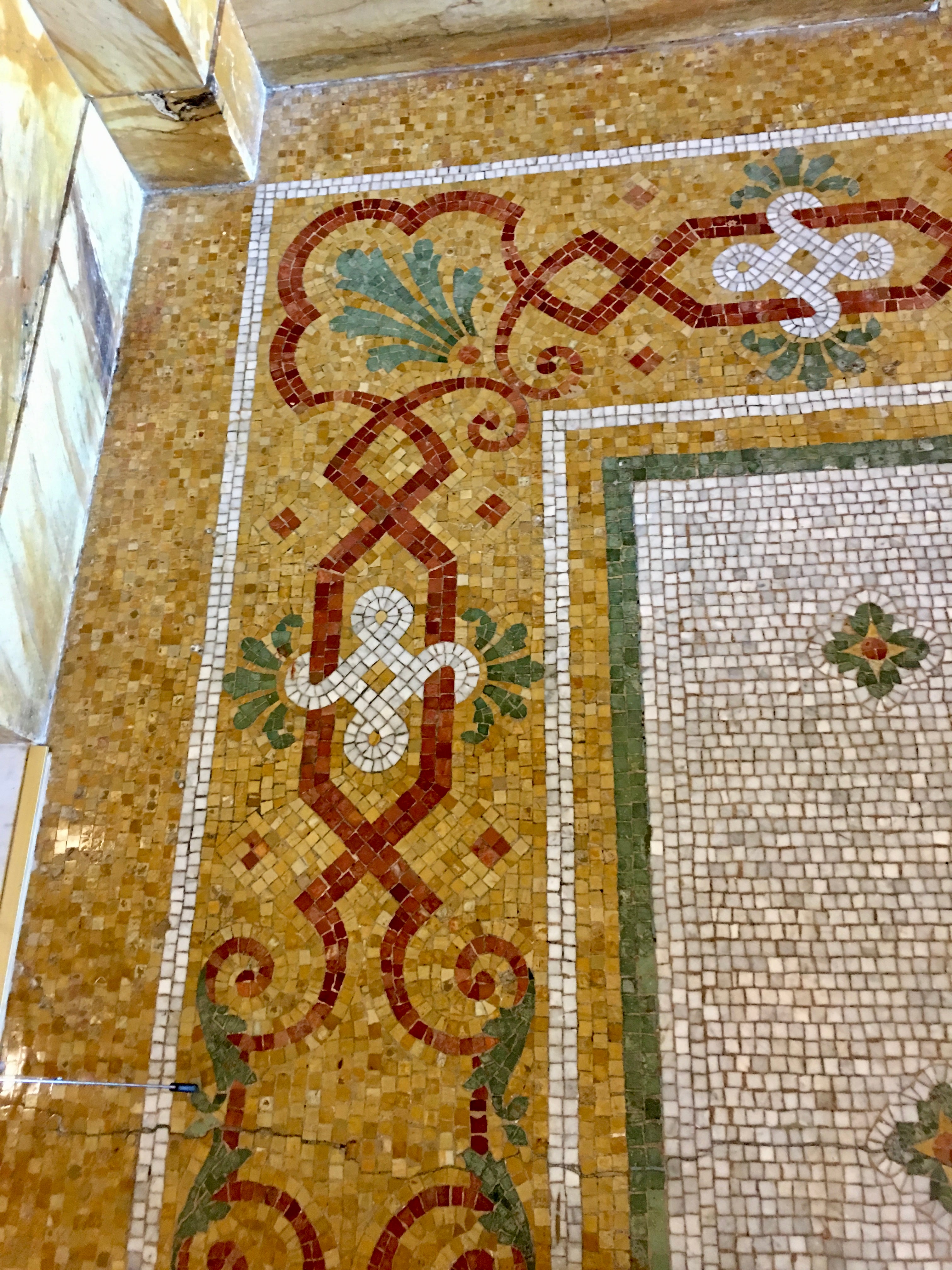 Decorative mosaic floor with intricate patterns and colors.
