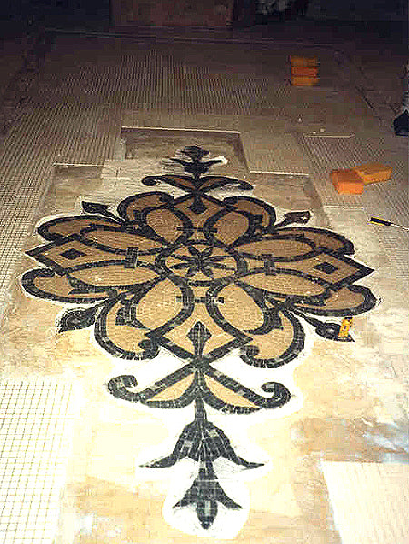 Decorative mosaic floor design on a tiled floor