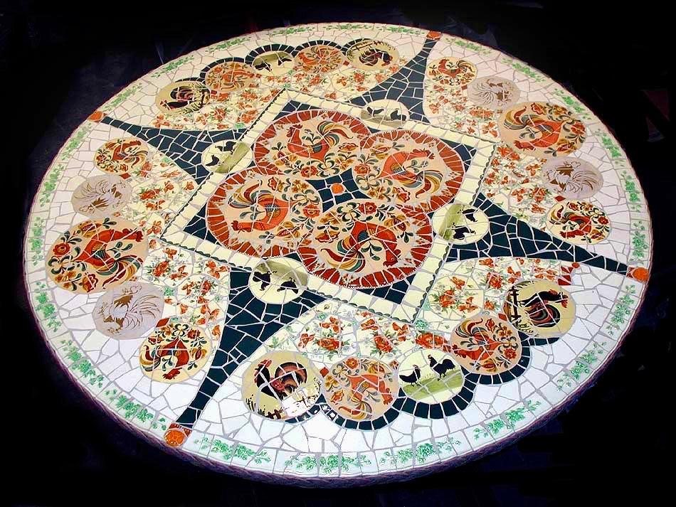 Decorative round mosaic table with intricate patterns on a dark background