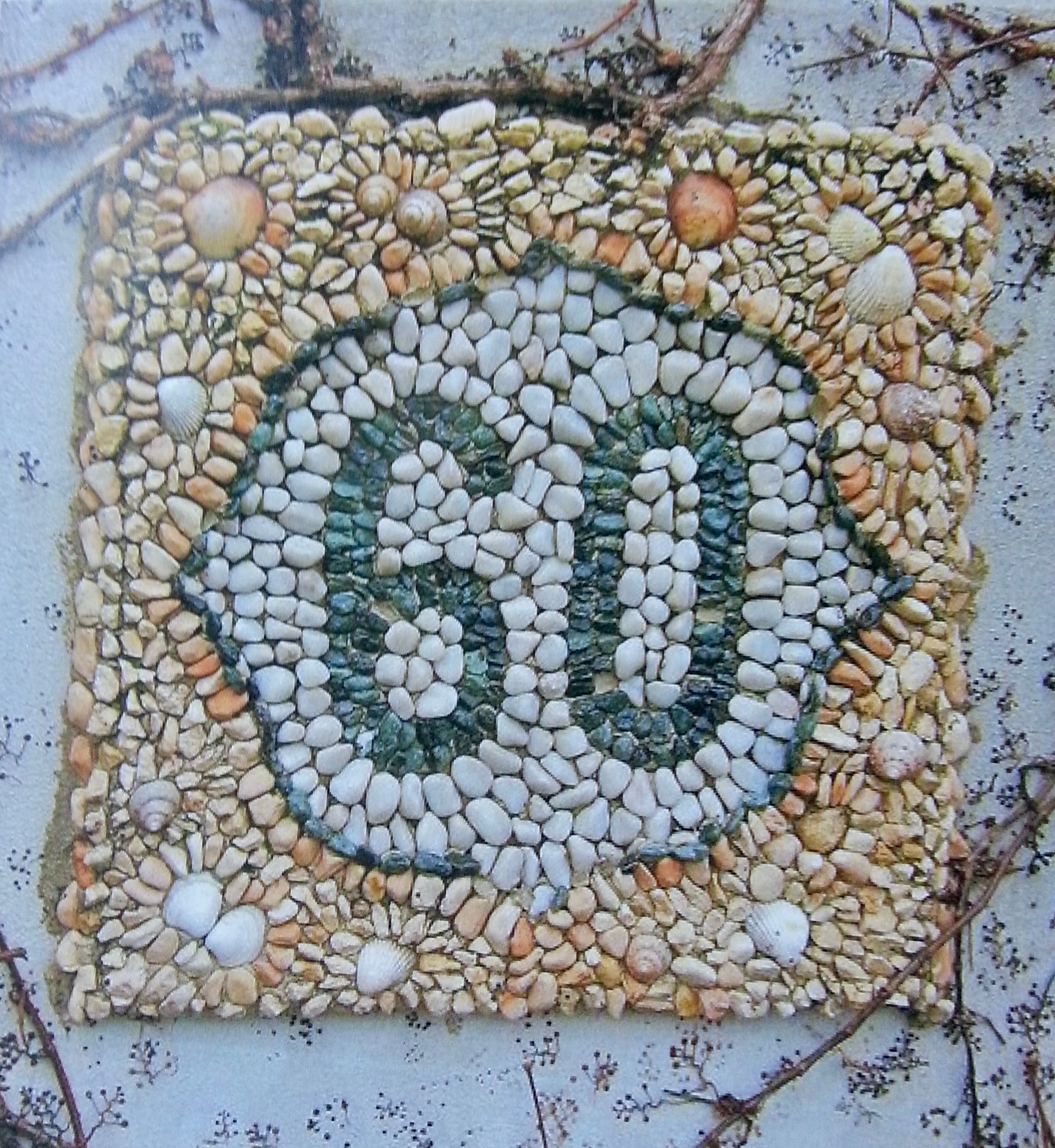 Mosaic art made of stones and pebbles on a textured surface